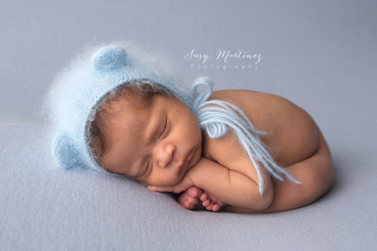 newborn portraits with Susy Martinez Photography in bonnet from Heartstrings by Susi