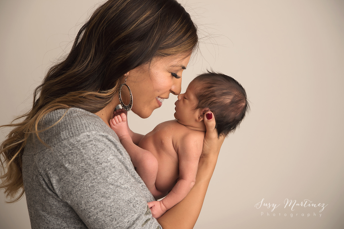 emotional mother and son portrait during newborn portraits with Susy Martinez Photography