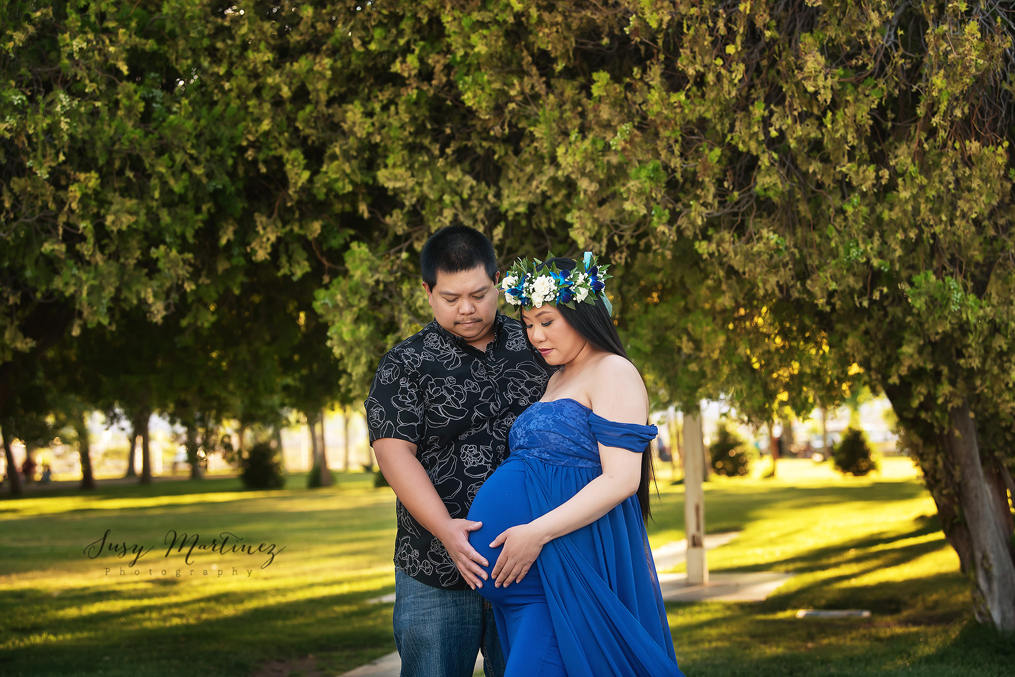 Floyd Lamb Park maternity session with mom in Hawaiian flower crown and royal blue Sew Trendy Accessories gown
