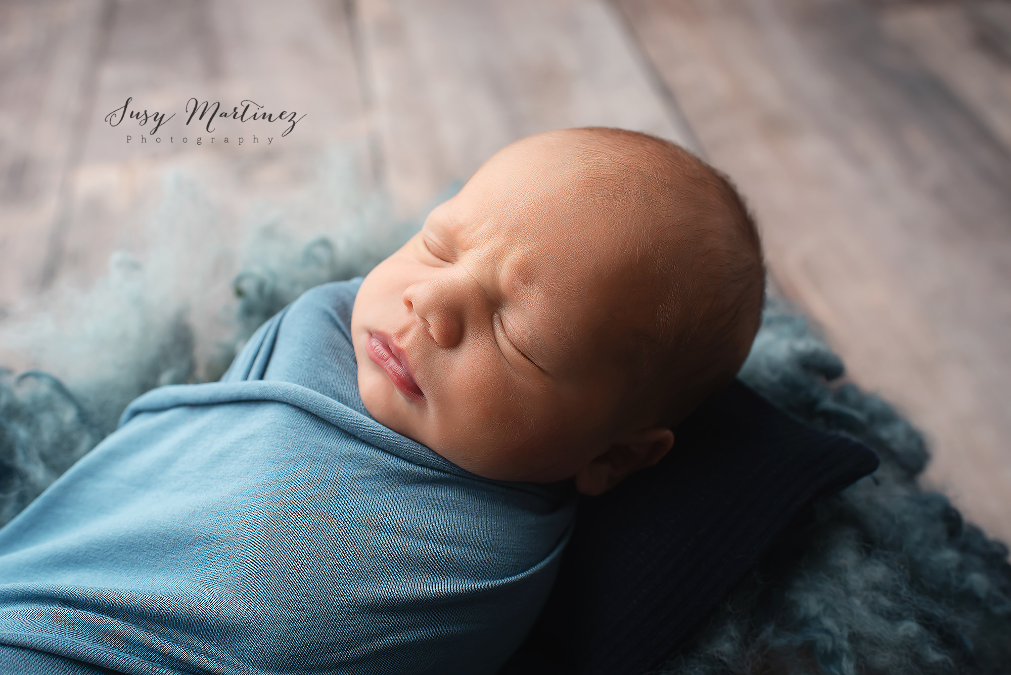 baby boy sleeps photographed by Henderson Newborn Photographer
