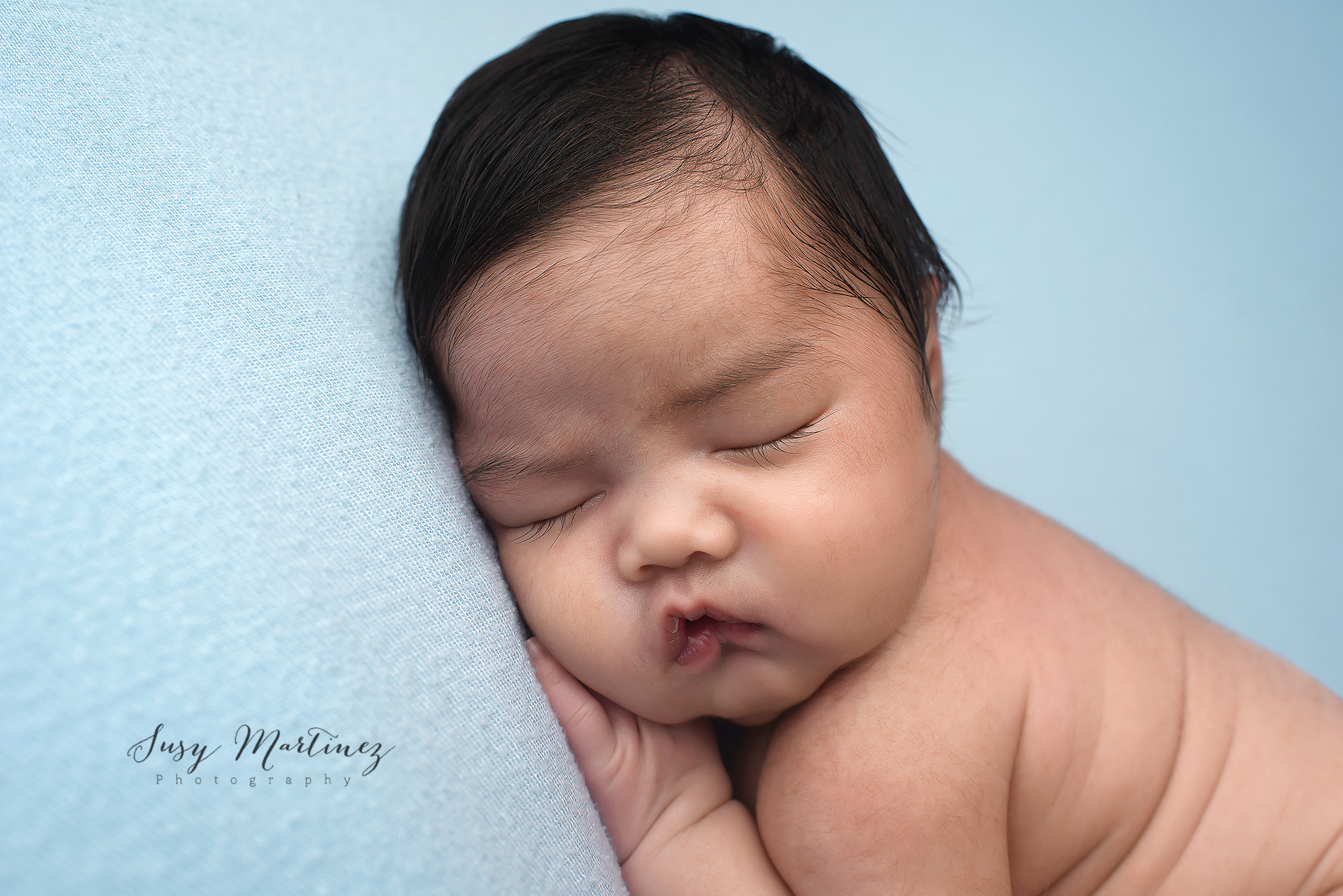 chunky baby boy sleeps during Studio Newborn Portraits in Las Vegas