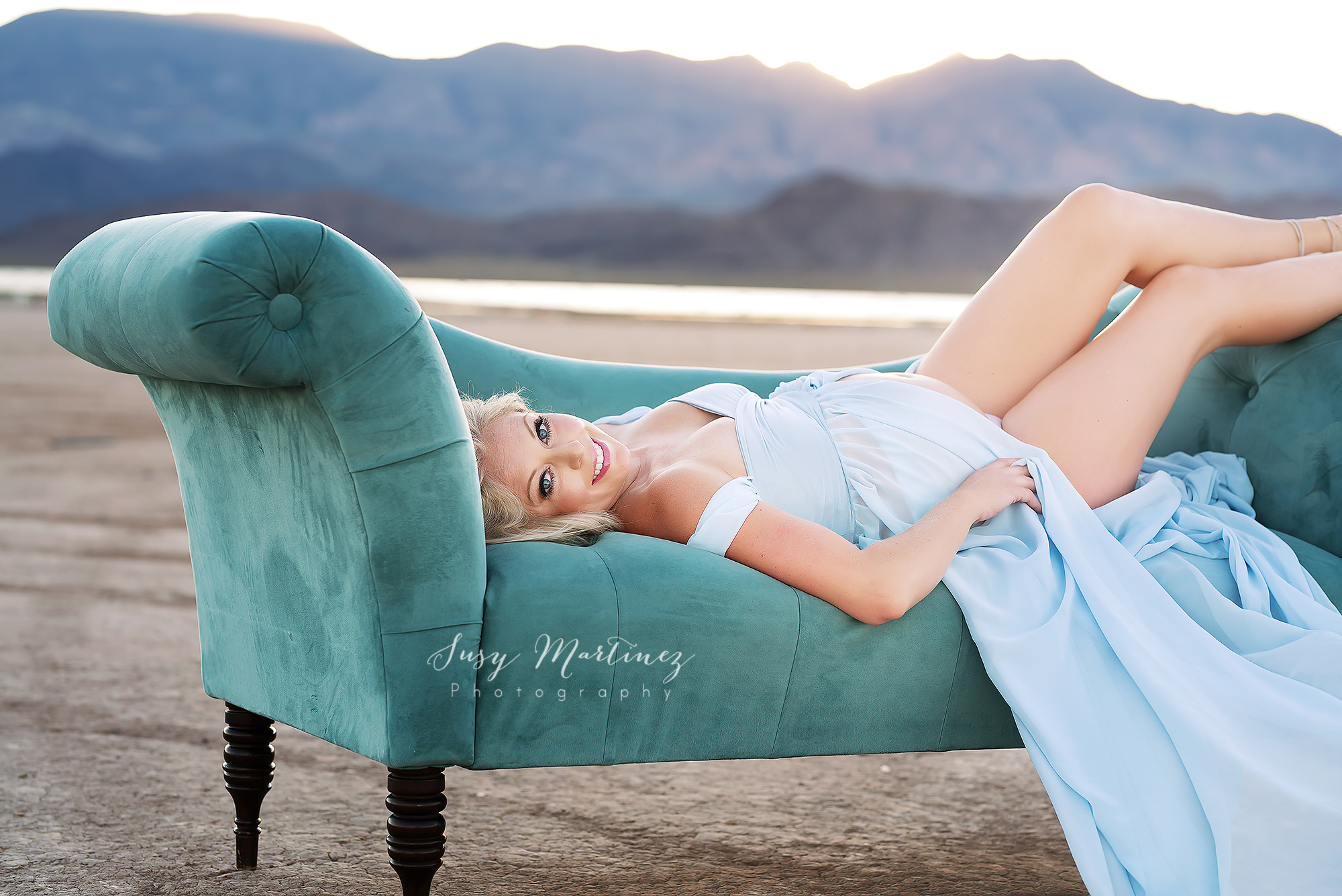 Las Vegas maternity session on teal couch in lake bed