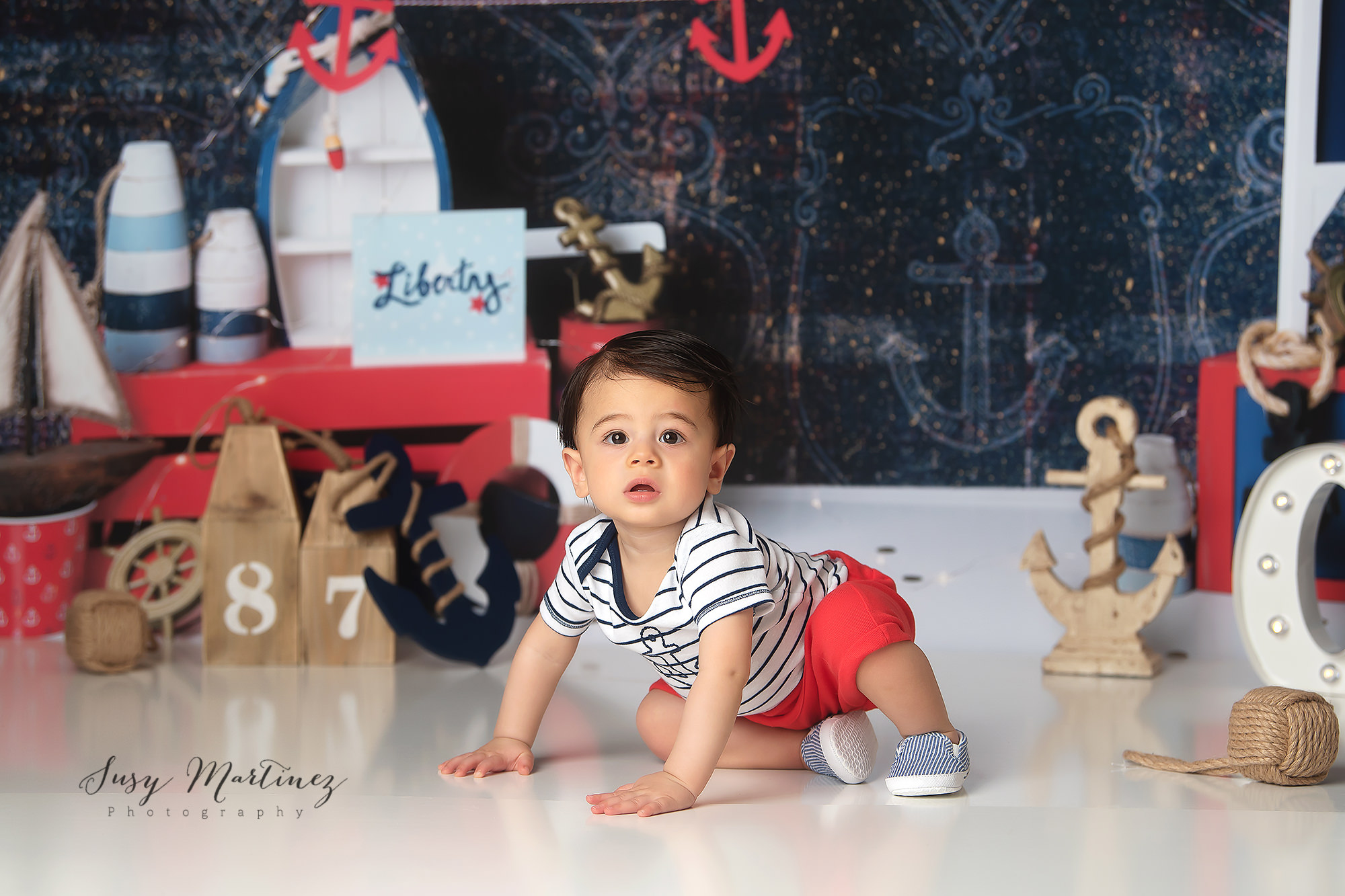 red and blue nautical inspired milestone portraits for one year old