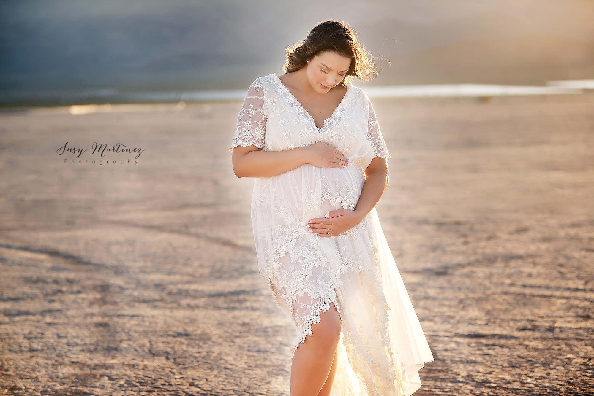 mom wears Sew Trendy Accessories Boho River Gown during maternity session in Las Vegas