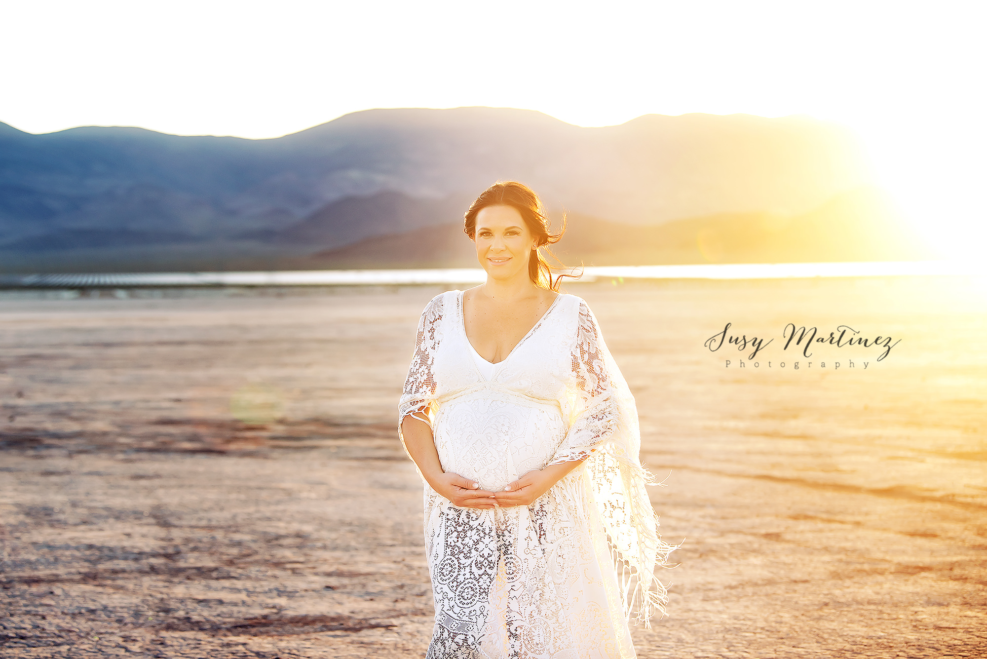 mom holds baby belly wearing Sew Trendy Accessories gown