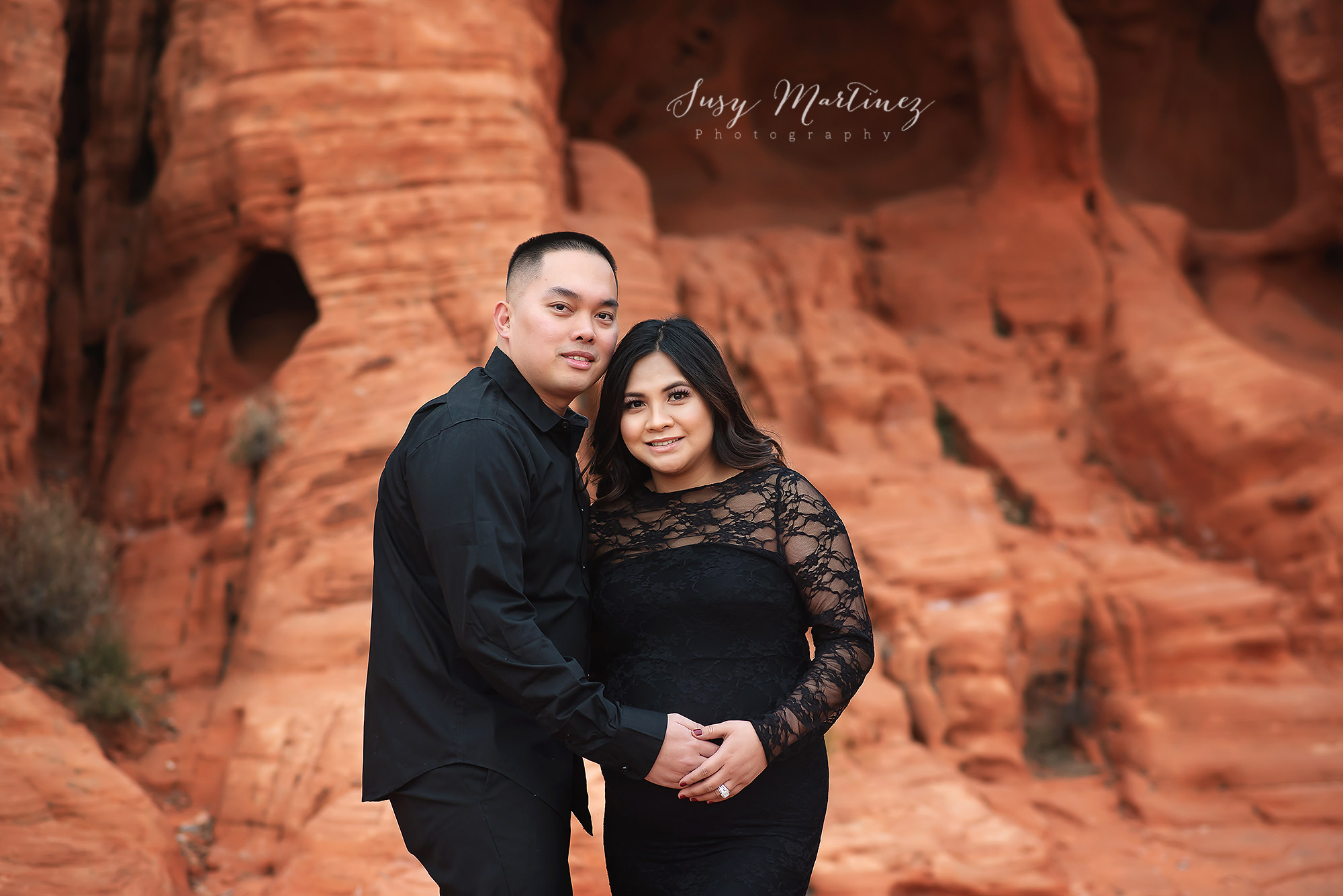 parents hold mom's belly during Nevada maternity session