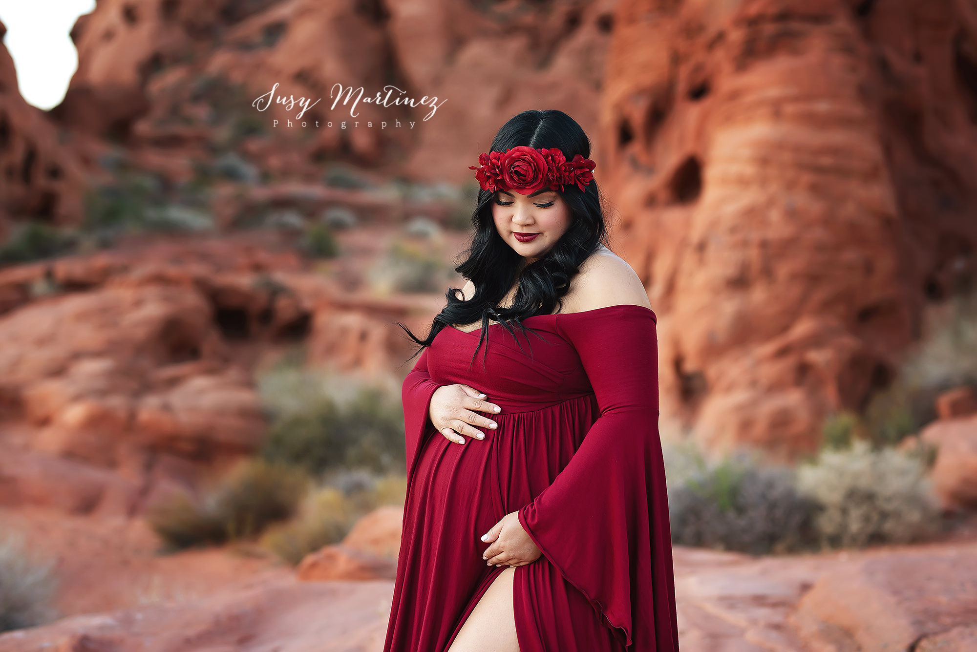 mom holds belly wearing cranberry Sew Trendy Accessories during Valley of Fire Maternity Session