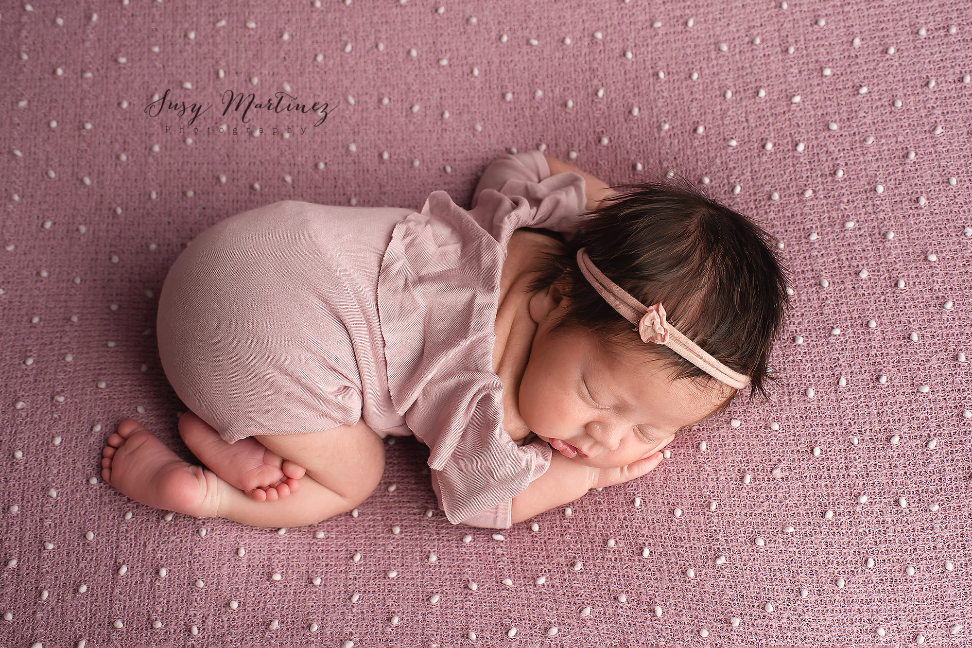 baby girl sleeps during rainbow baby newborn session