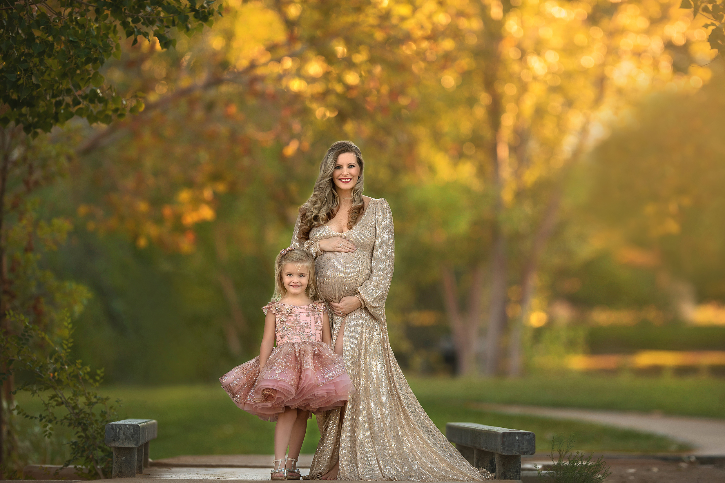 mom in gold Sew Trendy Accessories gown poses with toddler in pink and gold tutu at Floyd Lamb Park