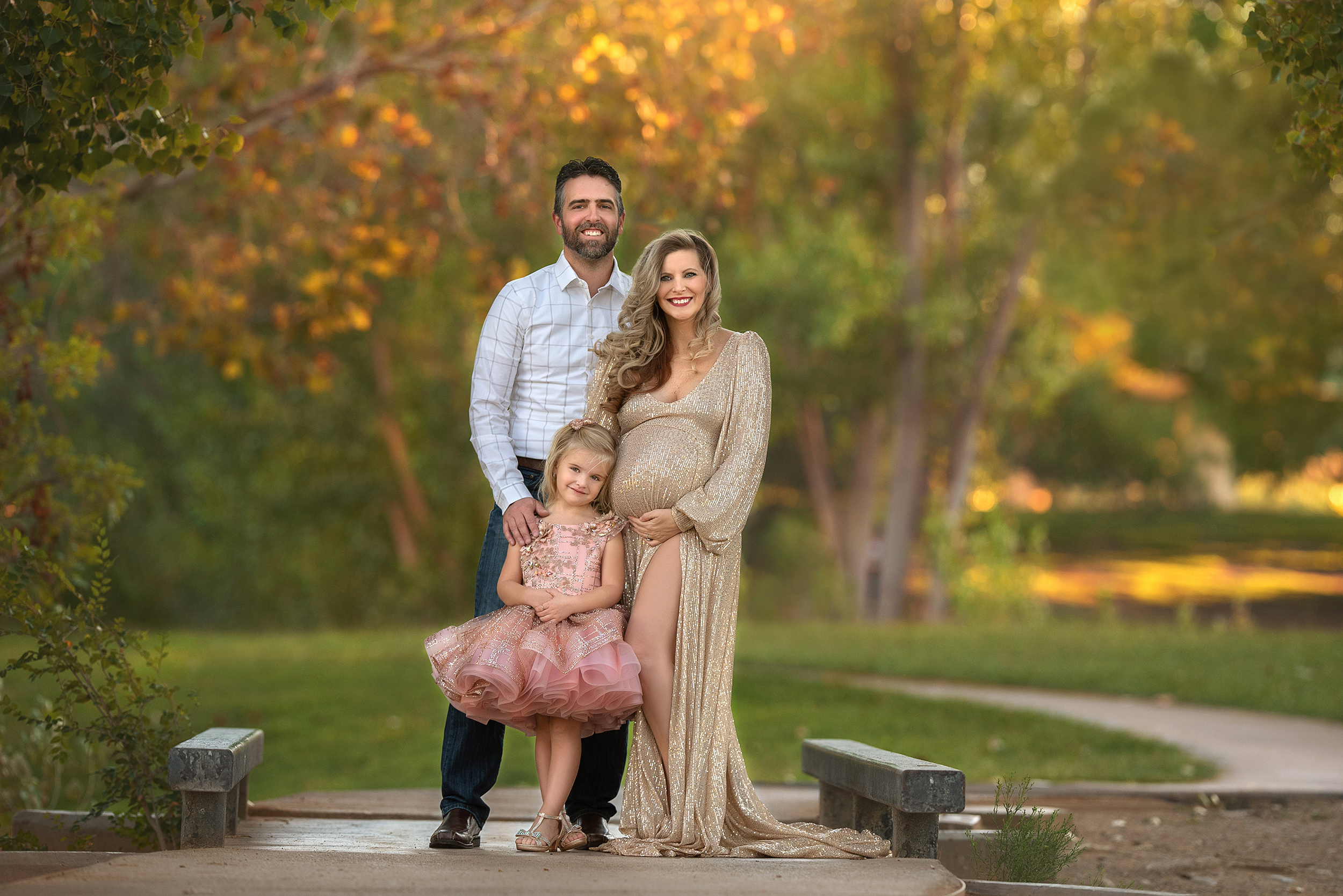 parents pose with daughter during Floyd Lamb Park maternity portraits 