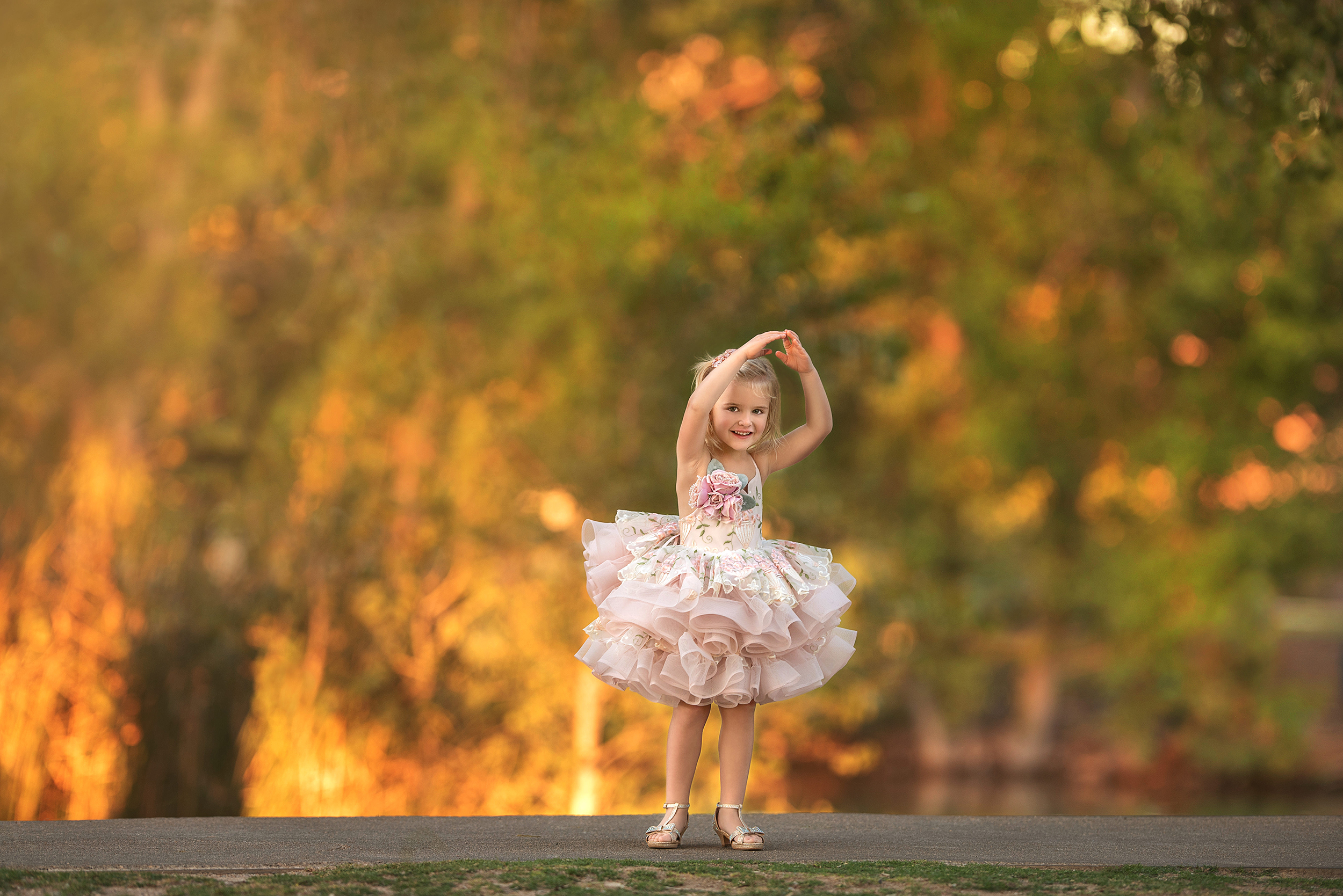 girl twirls in pink and Ivory tutu at Floyd Lamb Park