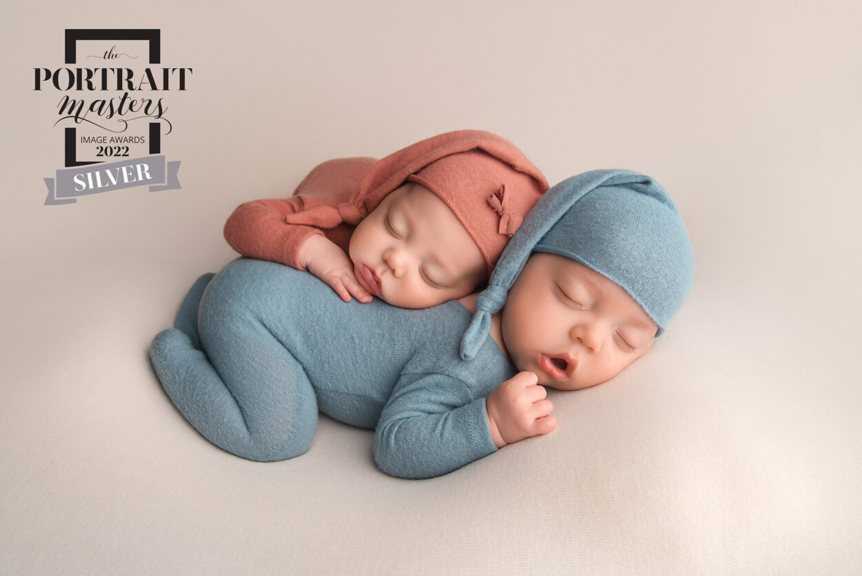 newborn twins lay together on bean bag during Las Vegas Studio newborn portraits